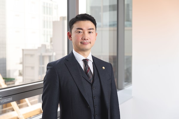 都 裕記弁護士のインタビュー写真
